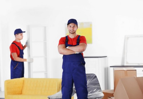 Removal team managing stairs and access during a flat move in Marylebone