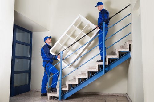 Furniture pick-up service handling a sofa in Marylebone