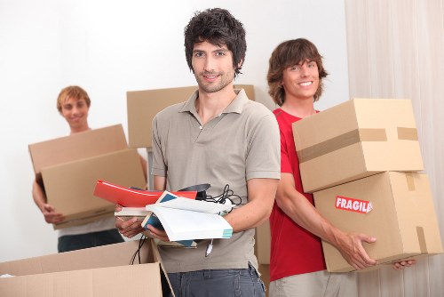 Moving boxes and furniture being prepared for a UK removal service