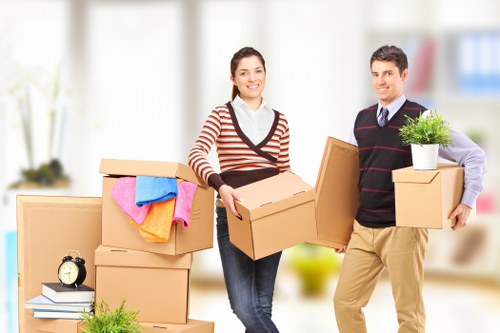 Professional movers handling household items during a relocation