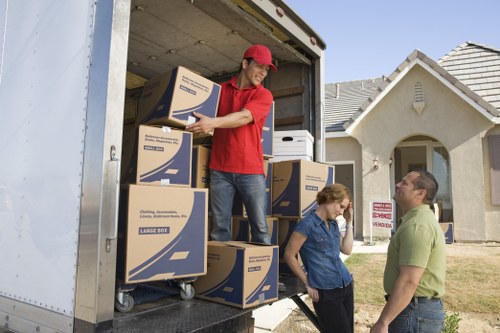 Professional movers packing boxes inside a Marylebone home